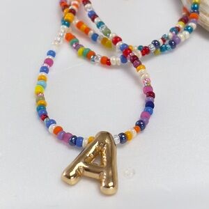 Colorful Beaded Necklace with Gold Letters Pendant